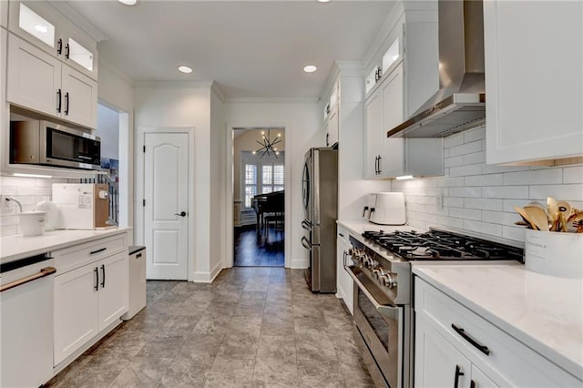 3355 Olivia Ct, Cumming, GA 30041 - kitchen featuring wall chimney exhaust hood, appliances with stainless steel finishes, ornamental molding, white cabinetry, and glass insert cabinets