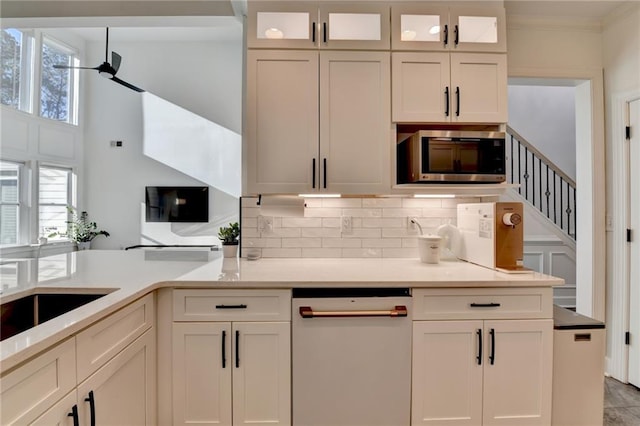 3355 Olivia Ct, Cumming, GA 30041 - kitchen with dishwasher, stainless steel microwave, white cabinets, and ornamental molding