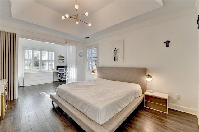 3355 Olivia Ct, Cumming, GA 30041 - bedroom featuring a raised ceiling, multiple windows, a chandelier, and dark wood-type flooring