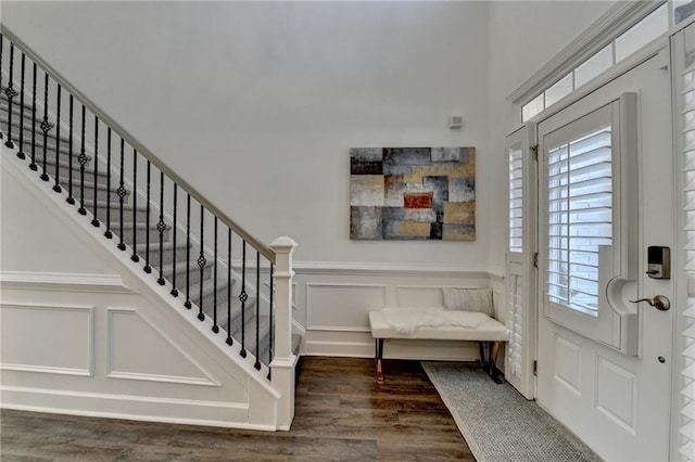 3355 Olivia Ct, Cumming, GA 30041 - foyer featuring wood finished floors, a decorative wall, stairway, and wainscoting