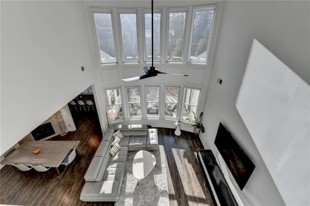 3355 Olivia Ct, Cumming, GA 30041 - living room featuring a towering ceiling, wood finished floors, and healthy amount of natural light