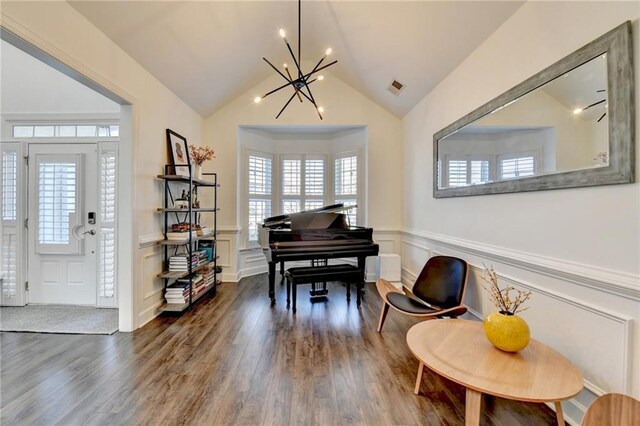 3355 Olivia Ct, Cumming, GA 30041 - living area featuring a decorative wall, a chandelier, dark wood-type flooring, plenty of natural light, and a wainscoted wall