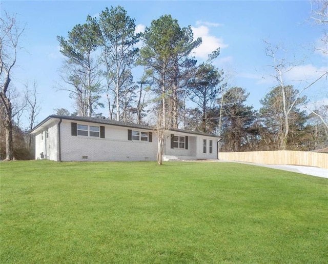 back of house featuring a yard