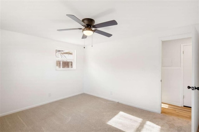 unfurnished room with ceiling fan and light colored carpet