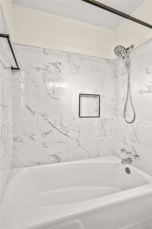 bathroom with shower / washtub combination