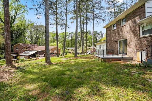 view of yard featuring a deck