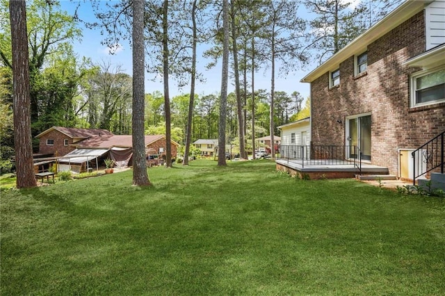 view of yard with a deck