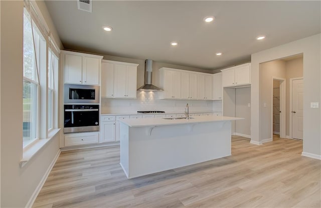 138 Crabbswood Dr, Mcdonough, GA 30253 - kitchen featuring wall oven, stainless steel microwave, wall chimney exhaust hood, a sink, and backsplash