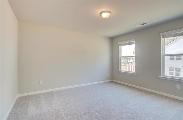 138 Crabbswood Dr, Mcdonough, GA 30253 - unfurnished room with baseboards, light colored carpet, and visible vents