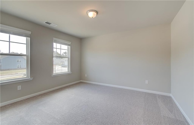138 Crabbswood Dr, Mcdonough, GA 30253 - carpeted empty room featuring baseboards and visible vents