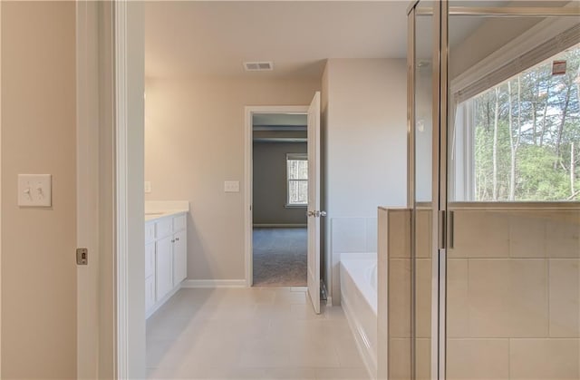 138 Crabbswood Dr, Mcdonough, GA 30253 - full bath with vanity, baseboards, tile patterned floors, visible vents, and a bath
