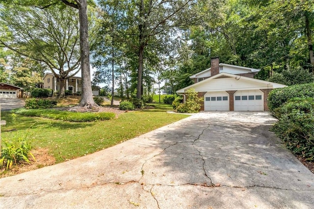 exterior space featuring a garage and a front lawn