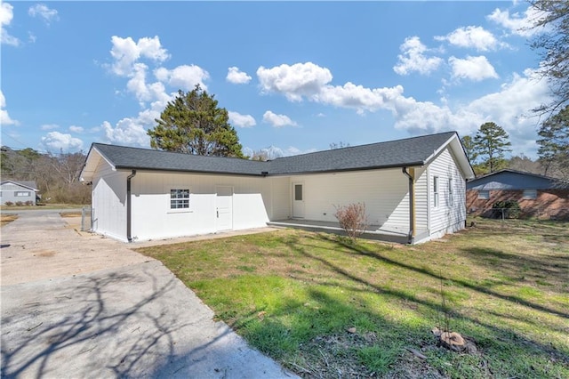 exterior space featuring a front lawn and fence