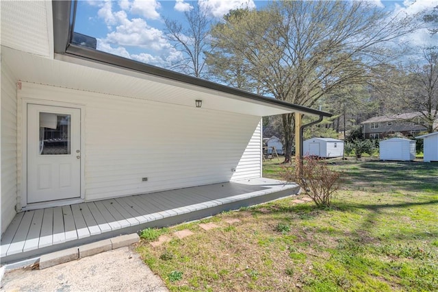 exterior space with an outbuilding, a yard, and a storage shed