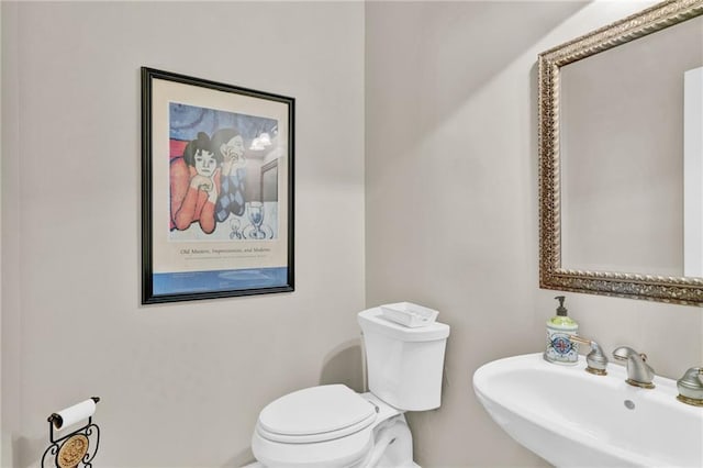 bathroom featuring a sink and toilet