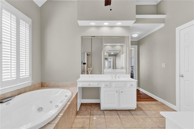 bathroom featuring vanity, ornamental molding, a whirlpool tub, and tile patterned floors