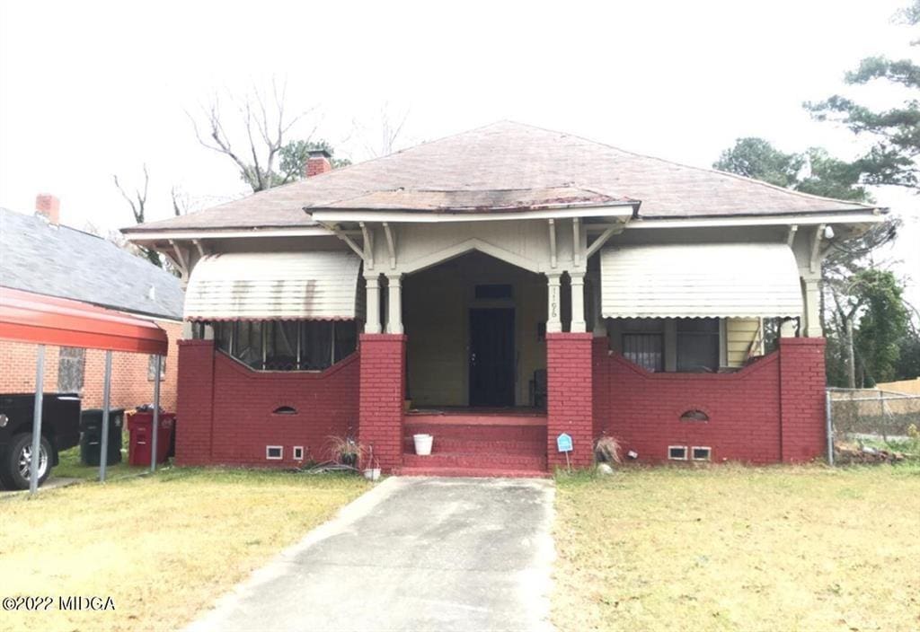 bungalow with a front lawn