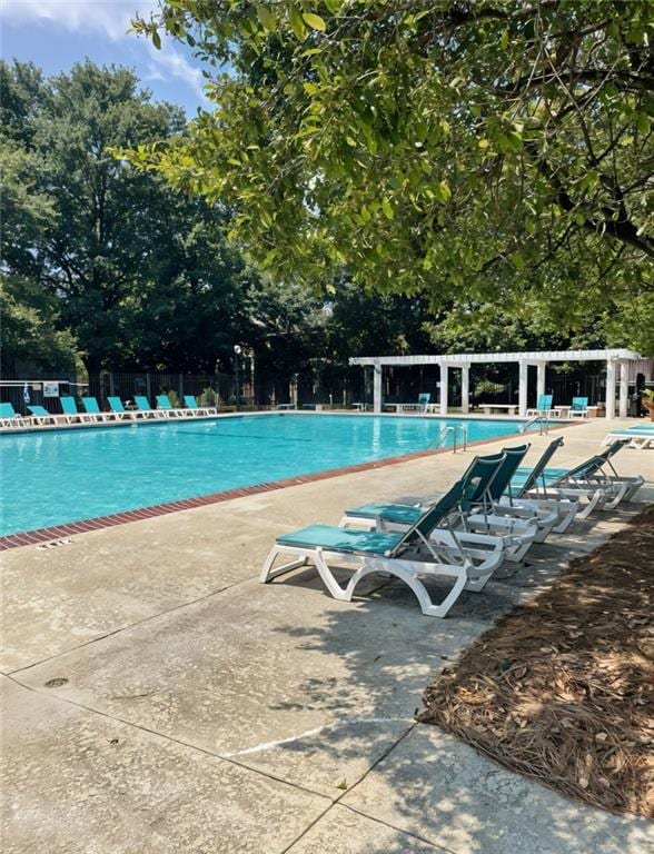 view of swimming pool with a patio area