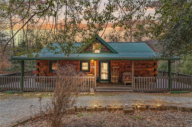 view of front of property with a porch and metal roof