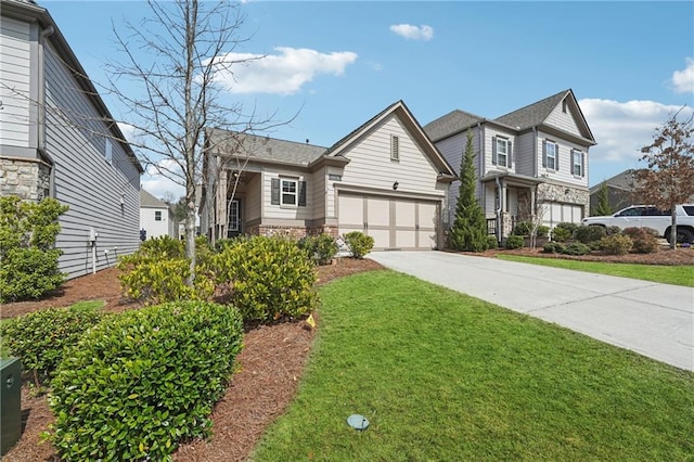 view of front facade featuring concrete driveway and a front lawn