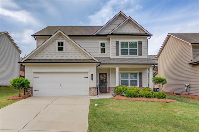 1102 Kingswood Way, Hoschton, GA 30548 - craftsman-style home with a front lawn, brick siding, concrete driveway, and a garage