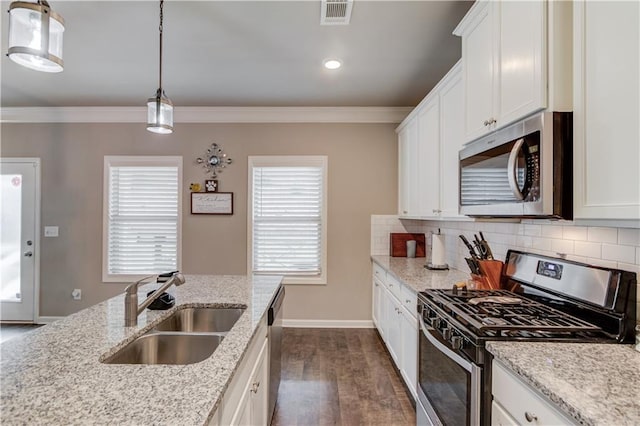 1102 Kingswood Way, Hoschton, GA 30548 - kitchen featuring stainless steel appliances, a sink, dark wood-style flooring, backsplash, and crown molding
