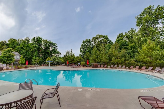 1102 Kingswood Way, Hoschton, GA 30548 - community pool featuring a patio and view of scattered trees