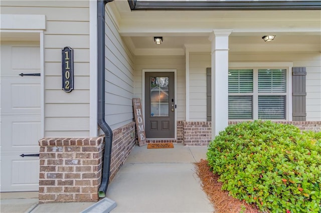 1102 Kingswood Way, Hoschton, GA 30548 - property entrance with covered porch and brick siding