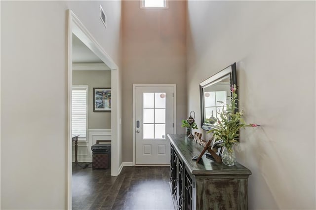 1102 Kingswood Way, Hoschton, GA 30548 - entryway with dark wood finished floors, a high ceiling, and wainscoting