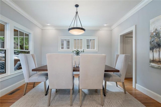 1066 High Point Dr, Atlanta, GA 30306 - dining area featuring crown molding, wood finished floors, and recessed lighting