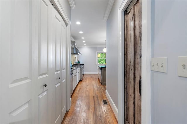 1066 High Point Dr, Atlanta, GA 30306 - corridor with ornamental molding, light wood finished floors, and recessed lighting