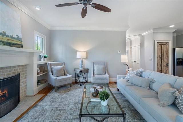 1066 High Point Dr, Atlanta, GA 30306 - living room with crown molding, a ceiling fan, a brick fireplace, recessed lighting, and wood finished floors