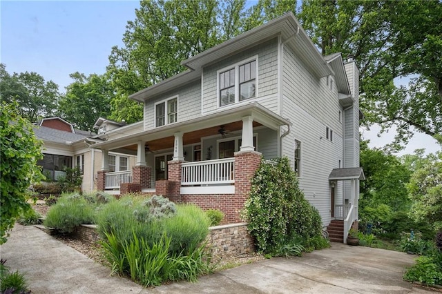 1066 High Point Dr, Atlanta, GA 30306 - view of front facade featuring a ceiling fan, covered porch, and brick siding