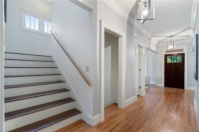 1066 High Point Dr, Atlanta, GA 30306 - foyer entrance with crown molding, stairs, and light wood-type flooring