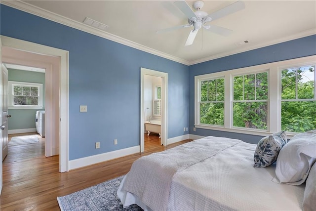 1066 High Point Dr, Atlanta, GA 30306 - bedroom with ornamental molding, wood finished floors, washer / clothes dryer, ceiling fan, and ensuite bathroom