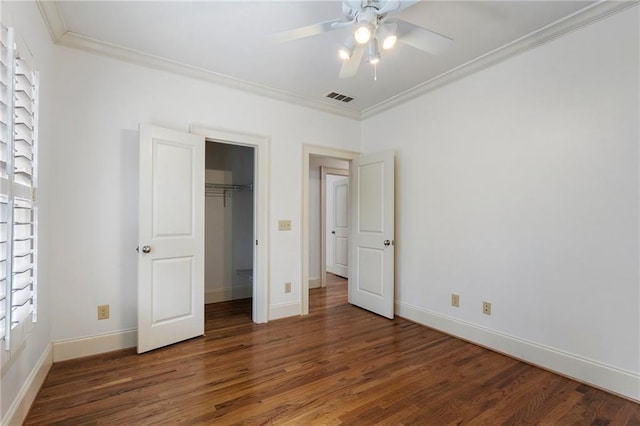 1066 High Point Dr, Atlanta, GA 30306 - unfurnished bedroom with crown molding, wood finished floors, a closet, multiple windows, and a ceiling fan