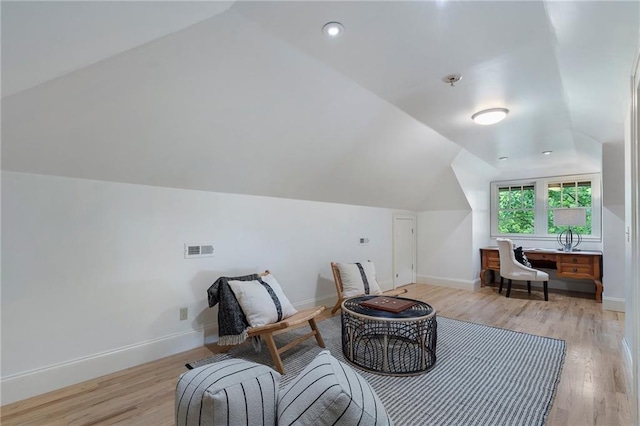 1066 High Point Dr, Atlanta, GA 30306 - living area featuring vaulted ceiling and light wood-style floors