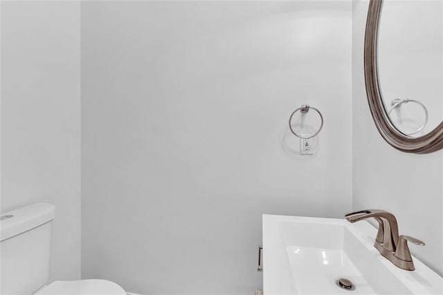 bathroom featuring sink and toilet