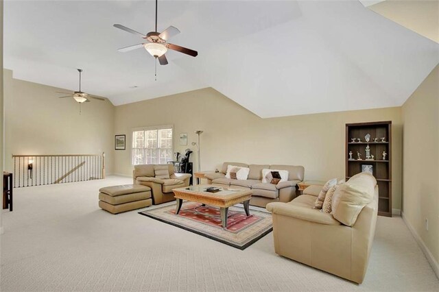 living area with a ceiling fan, carpet floors, vaulted ceiling, and built in shelves