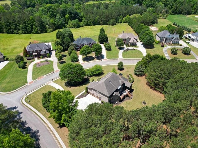 aerial view of property's location with nearby suburban area