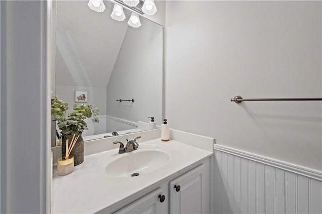 bathroom featuring vanity and vaulted ceiling