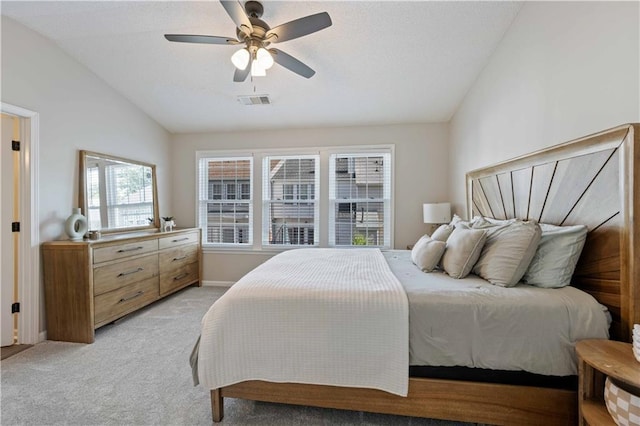 bedroom featuring lofted ceiling, light carpet, ceiling fan, and baseboards