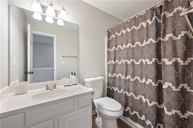 full bathroom with toilet, vanity, and a shower with curtain