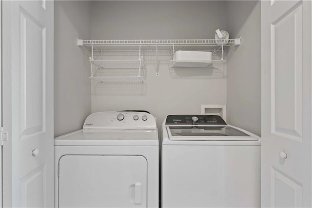 clothes washing area featuring washing machine and dryer