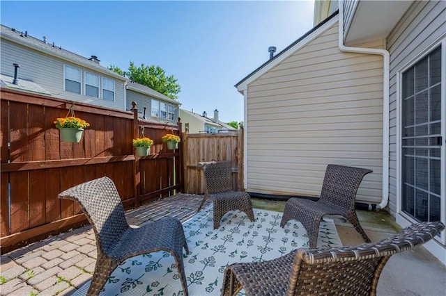 view of patio featuring fence