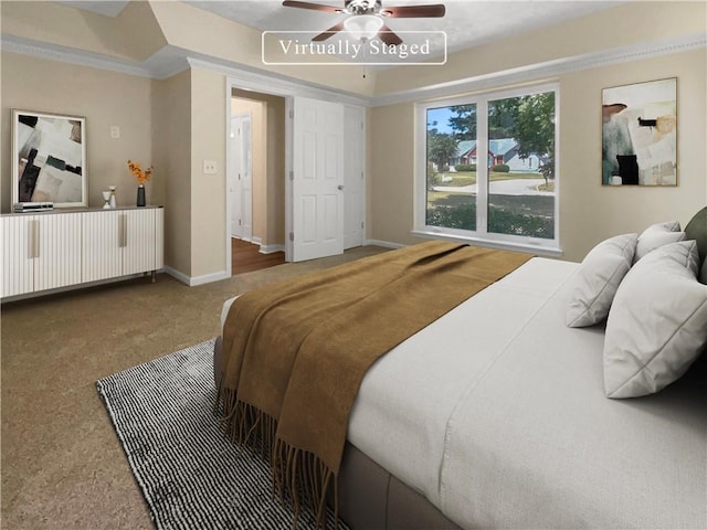 bedroom with ornamental molding, ceiling fan, and carpet