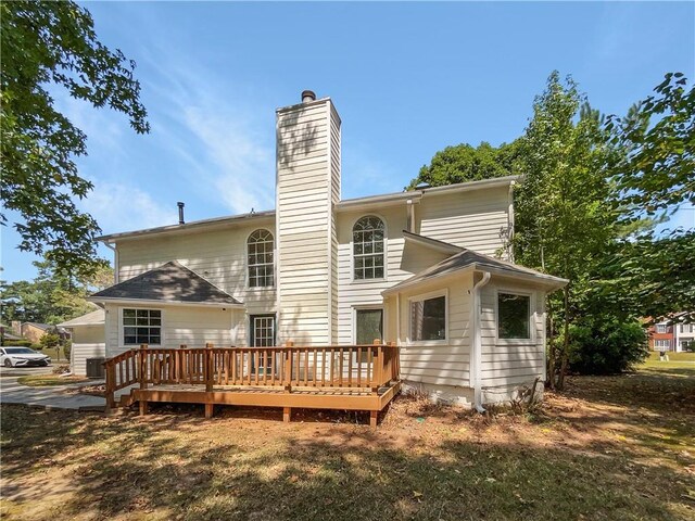 back of house featuring a deck