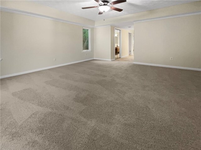 spare room with carpet flooring and ceiling fan