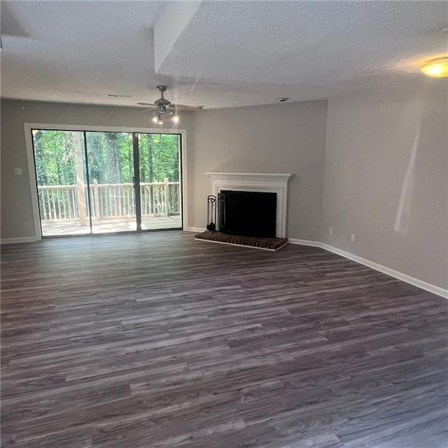 3045 Steeplechase, Alpharetta, GA 30004 - unfurnished living room with a ceiling fan, a textured ceiling, baseboards, dark wood finished floors, and a fireplace