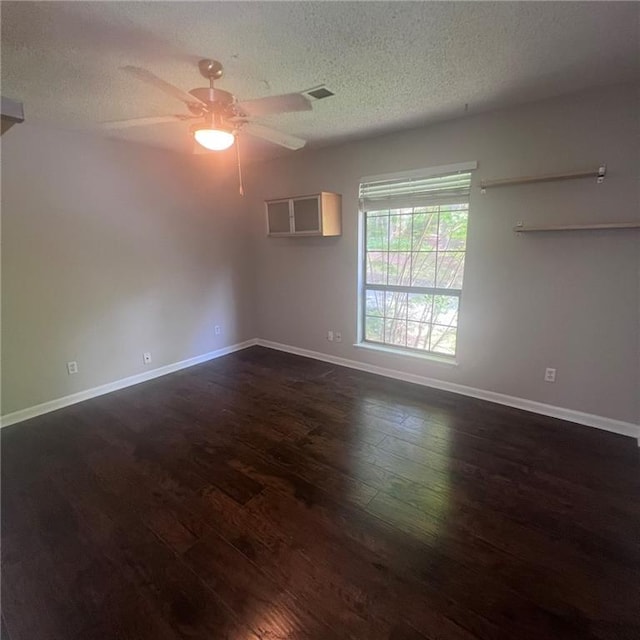 3045 Steeplechase, Alpharetta, GA 30004 - unfurnished room with dark wood finished floors, ceiling fan, a textured ceiling, and baseboards